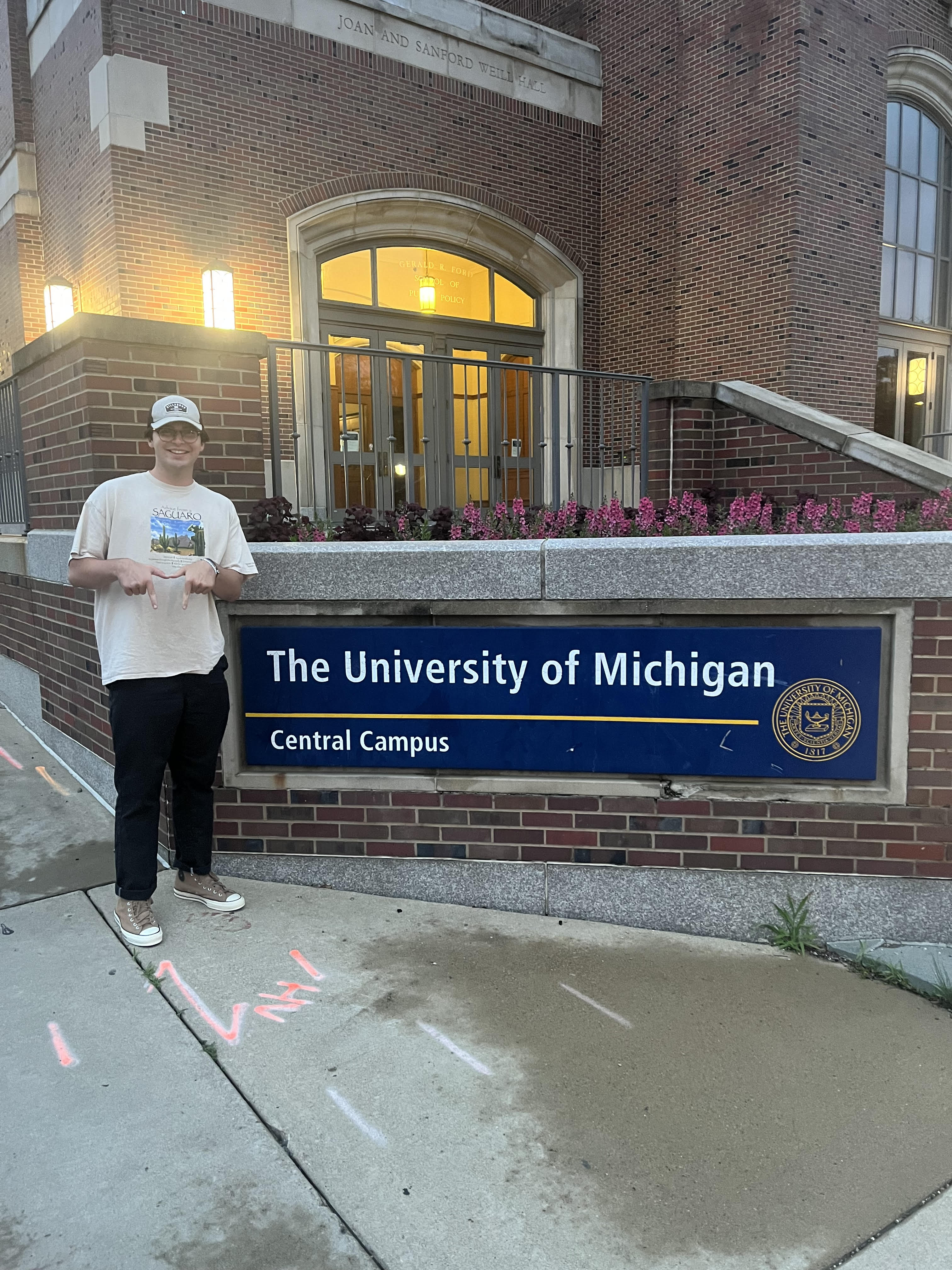 Image of me standing next to University of Michigan sign